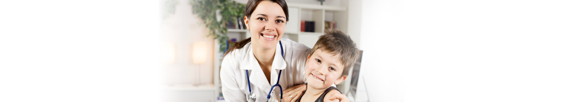 a doctor and a boy smiling